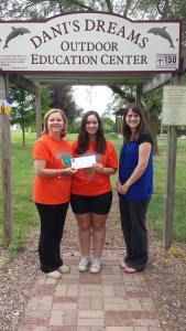 Christina Harkleroad, center, begins her internship as coordinator at Dani's Dreams Outdoor Education Center. Director Donna Griffin receives a grant from Kara Harrison of the Hancock County Community Foundation for Dani's Dreams Internship Program.